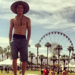 Ryan Potter shirtless at Coachella